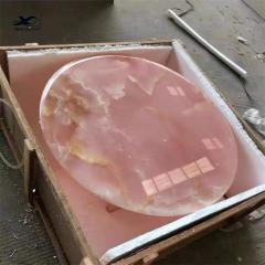Table basse et table d'appoint transparentes rondes en onyx rose
